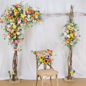 “Boho-style wildflower wedding arch decorated with sunflowers, daisies, dahlias, and ranunculus, perfect for a spring wedding backdrop, arbour, or gazebo