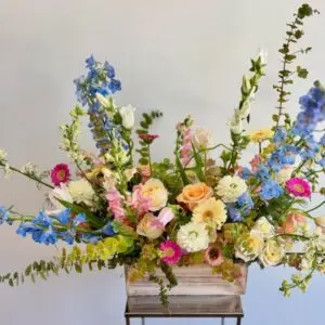 omantic floral arrangement featuring garden roses, ranunculus, lisianthus, stock, and seasonal greenery, inspired by Plato’s quote ‘Everyone becomes a poet,’ ideal for literary events, weddings, or thoughtful gifts