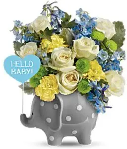 Celebrate a gorgeous baby boys arrival with this precious ceramic elephant, bursting with blue blooms and darling polka dots!