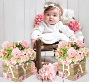 Baby shower table centerpiece with a mix of pink and blue flowers, ideal for a gender reveal or baby birthday party